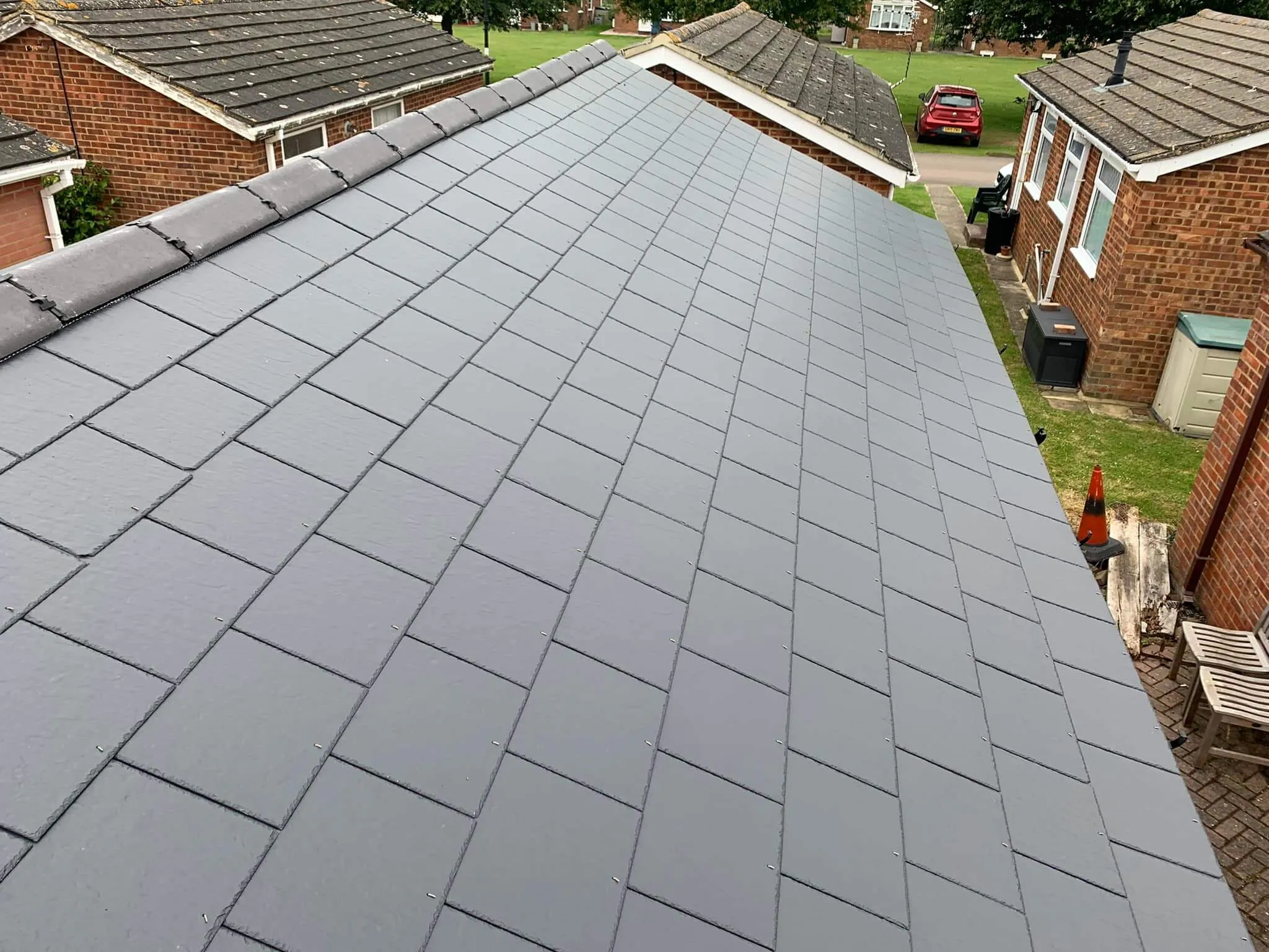 A view of a roof of a house in a residential area.